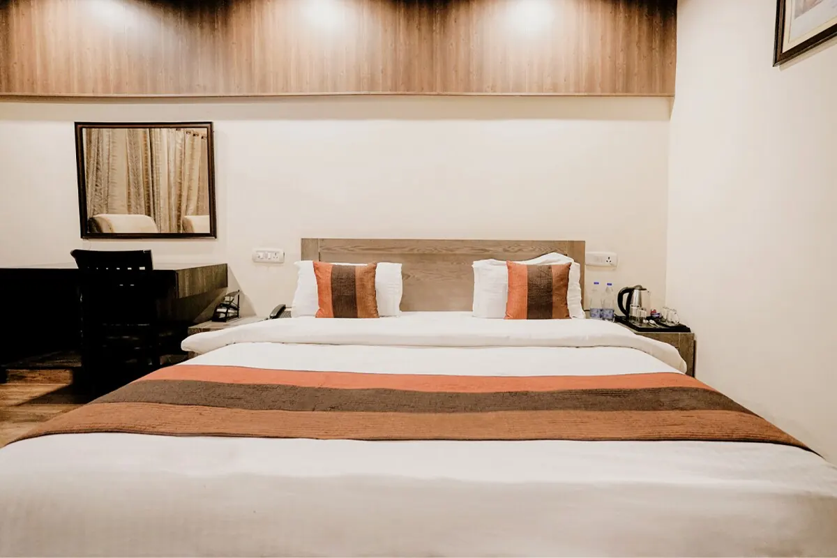 Superior Deluxe Room with king bed and warm accents